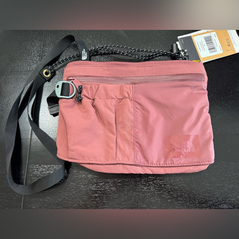 The North Face Mountain Crossbody in color Plum NWT